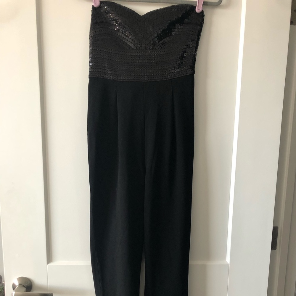 Express black jump suit with sequins on top